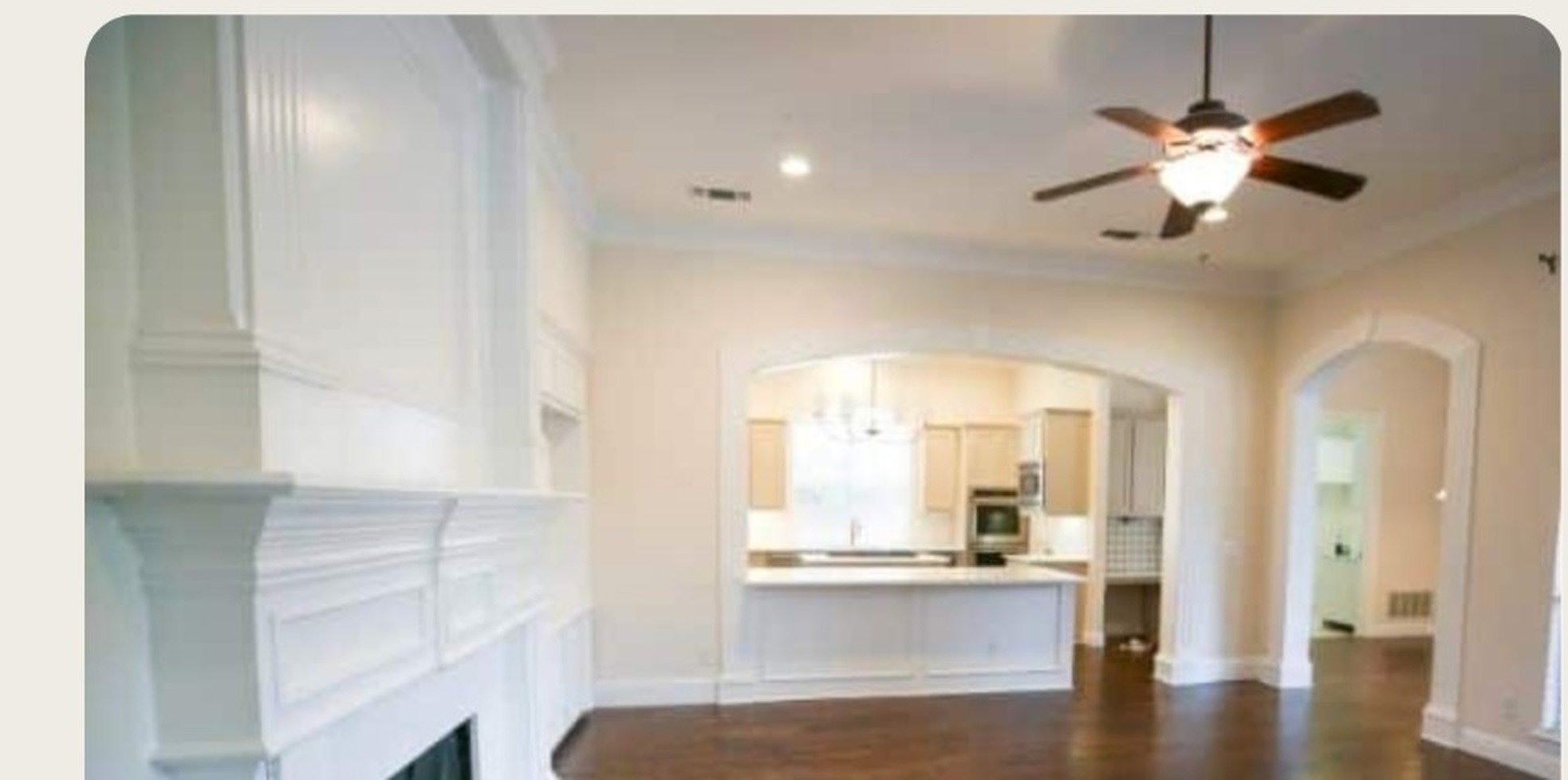 Living room with wood-look laminate flooring and fireplace
